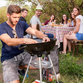 Sturdy round portable charcoal grill with wheels.